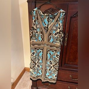 Beautiful dress, soft, silky fabric. Very flattering and comfortable. Size 16.